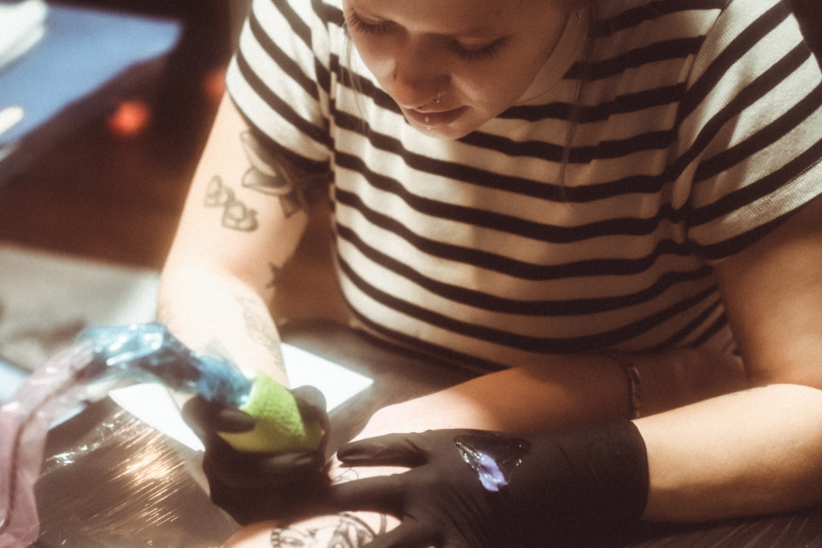 Tattoo artist at work in Liberty Hill Tattoo Company studio